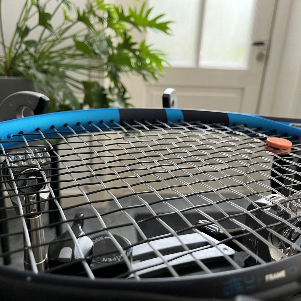 Bespannen tennisracket